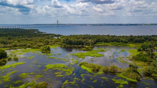 Scenic view of lake and river against sky