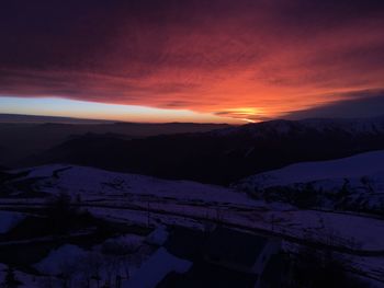 Scenic view of dramatic landscape during sunset