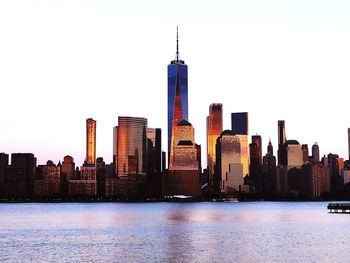 Modern buildings in city against clear sky