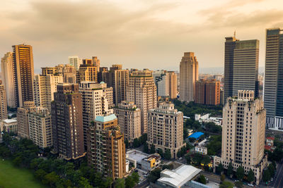 High angle view of buildings in city against sky