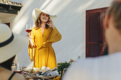 Happy woman holding wineglass