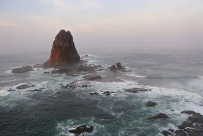 Sunset at papuma beach, jember, indonesia.