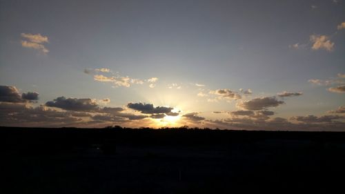 Silhouette landscape against sky during sunset