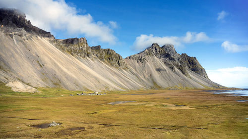 Scenic view of landscape and mountains against sky