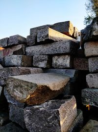 Low angle view of stone wall against sky