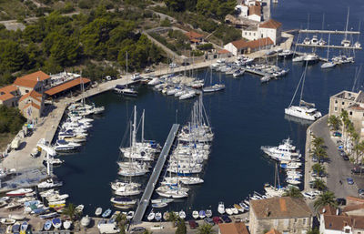 High angle view of boats moored in harbor at sea