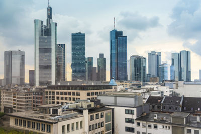 Modern buildings in city against sky