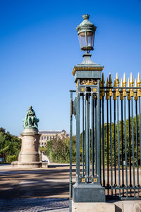 Statue of historic building against clear blue sky