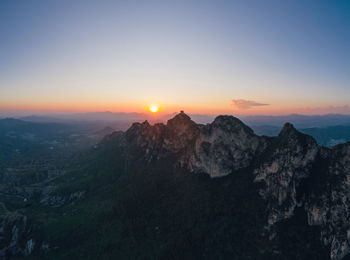 Scenic view of mountains against sky during sunset