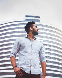 Full length of young man looking away