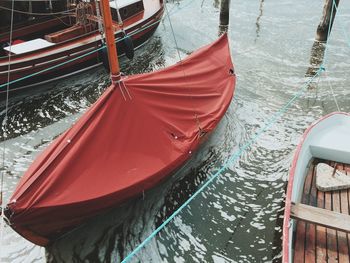 High angle view of boat covered with red fabric