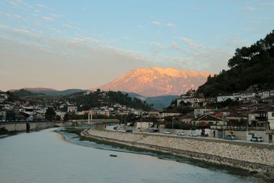 Scenic view of river against sky during sunset