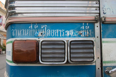 Close-up of blue bus