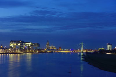 Illuminated city buildings at waterfront