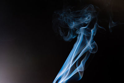 Close-up of smoke against black background