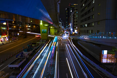 High angle view of light trails on road at night