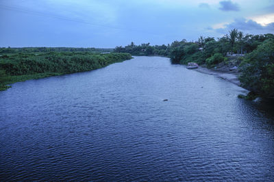 Scenic view of river against sky