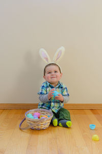 Cute boy playing with toy on table