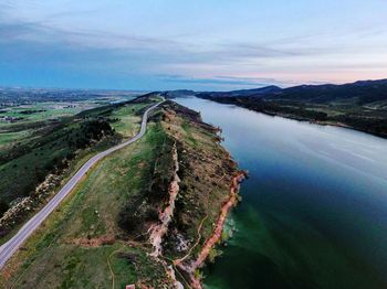 Panoramic view of road by sea against sky