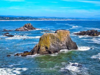 Scenic view of sea against blue sky
