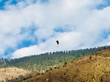 Low angle view of kite flying against sky