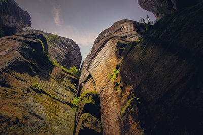 Low angle view of rock formation against sky