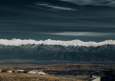 Scenic view of snowcapped mountains against sky