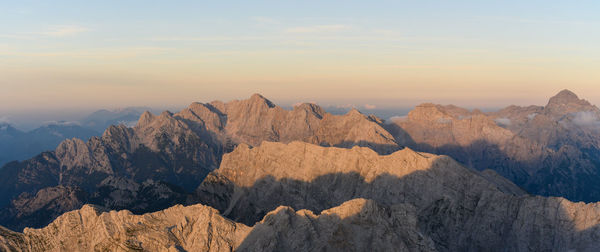 Scenic view of mountains against sky during sunset