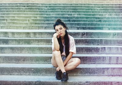 Portrait of woman sitting on steps