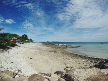 Scenic view of sea against cloudy sky