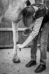 Man standing by horse