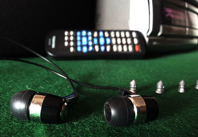 Close-up of in-ear headphones on table