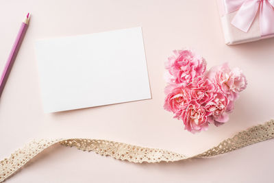 High angle view of pink flower on table