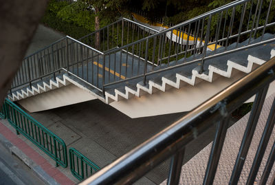 High angle view of steps by footbridge