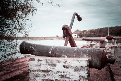 Full length of snow on metal structure against sky
