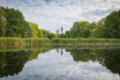 Reflection of trees in lake against sky