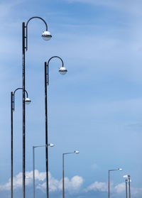 Low angle view of street light against sky