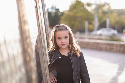 Portrait of girl standing outdoors