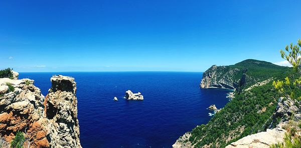 High angle view of sea against clear blue sky