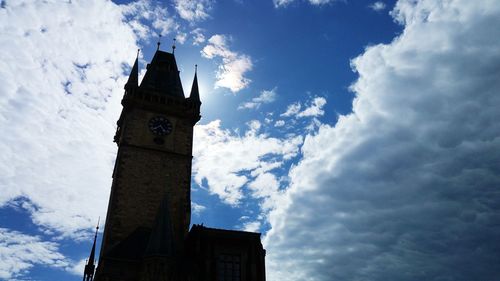 Low angle view of clock tower against sky