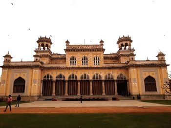 Facade of historic building against clear sky