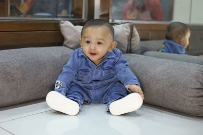 Cute boy sitting at home