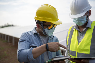 Side view of man working at construction site