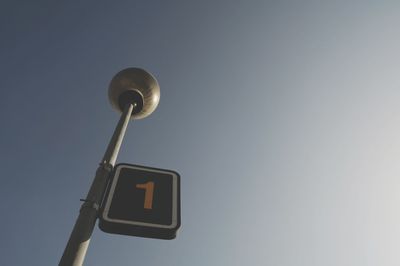 Low angle view of street light against sky