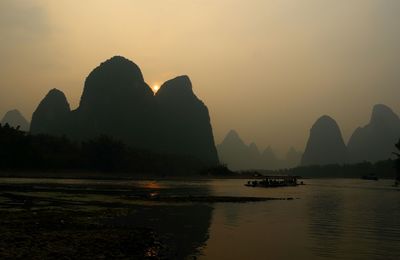 Scenic view of sea with mountains in background