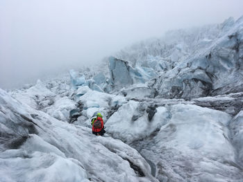 Person on snow covered mountain