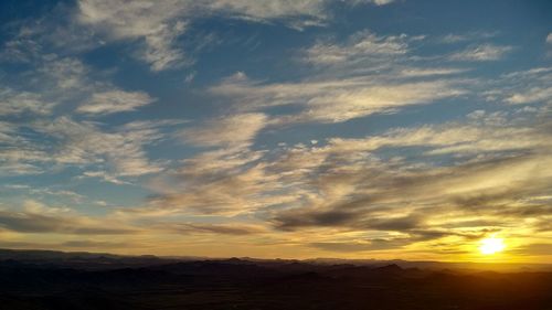 Low angle view of dramatic sky during sunset