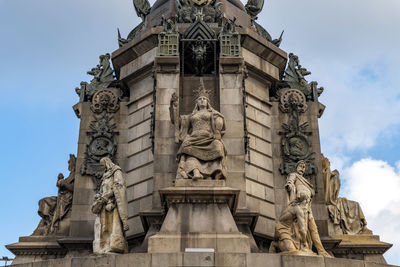 Low angle view of statue against sky