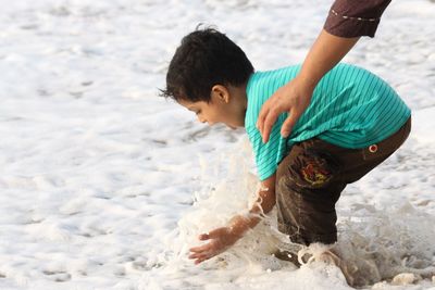 Boy playing on beach