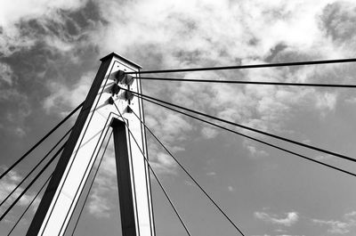 Low angle view of suspension bridge against sky